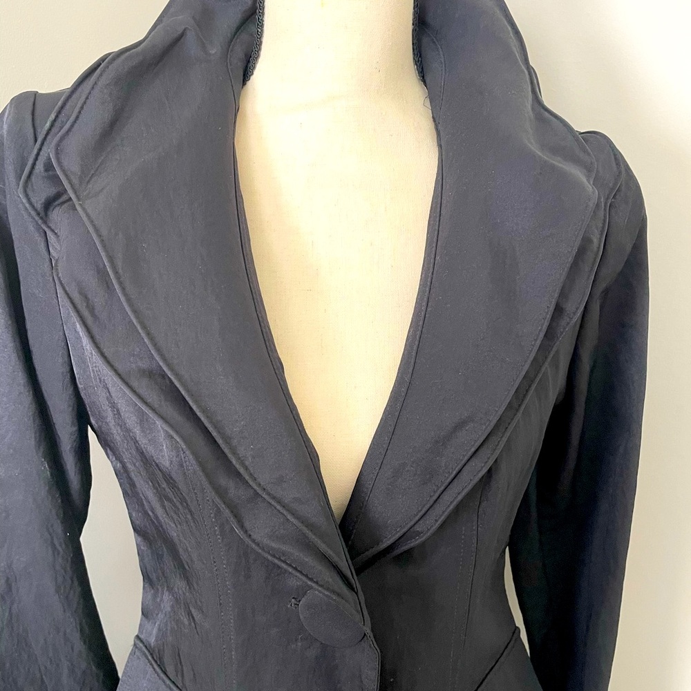 Beautiful stylish raincoat. Size small, worn 3 to 4 times.